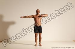 Underwear Gymnastic poses Man Black Muscular Bald Dancing Dynamic poses Academic